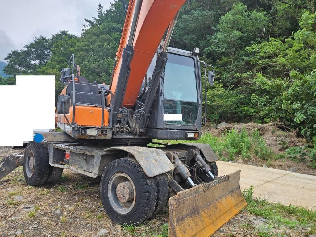 Doosan DX 210 W  휠 굴삭기