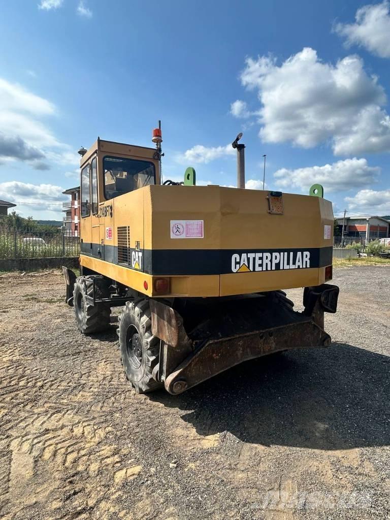 CAT 214  휠 굴삭기