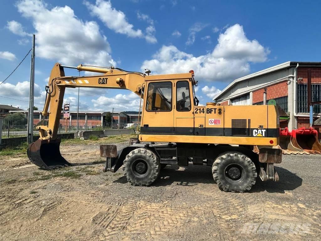 CAT 214  휠 굴삭기