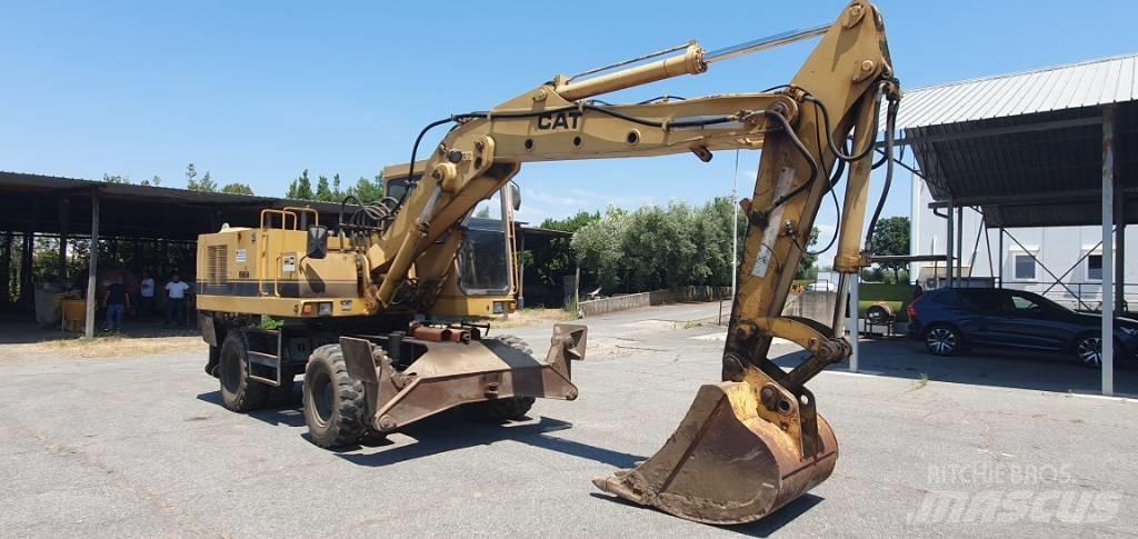 CAT 214 B  휠 굴삭기
