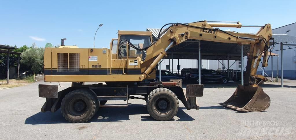 CAT 214 B  휠 굴삭기