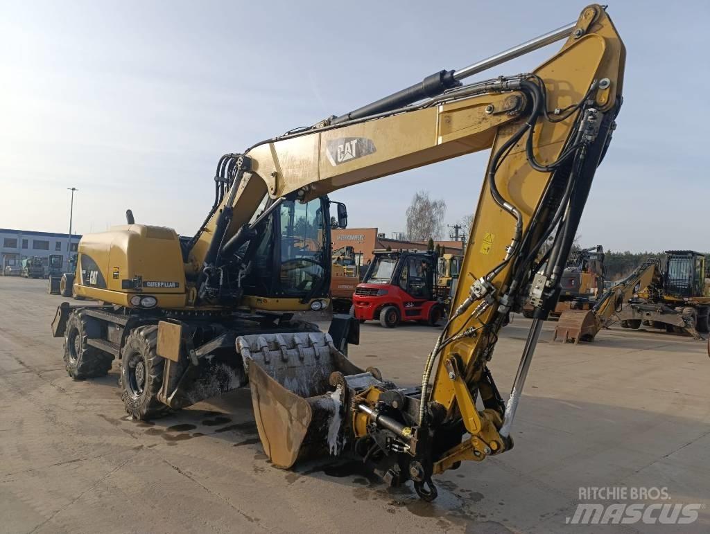 CAT M 313 D  휠 굴삭기