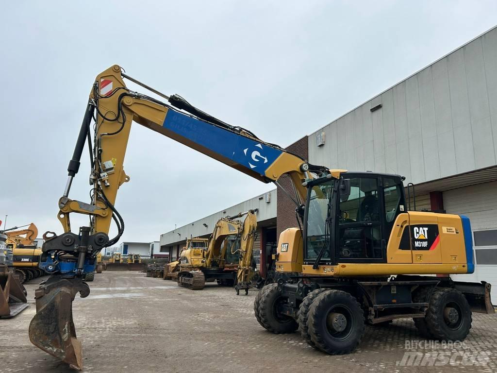 CAT M 318 F  휠 굴삭기