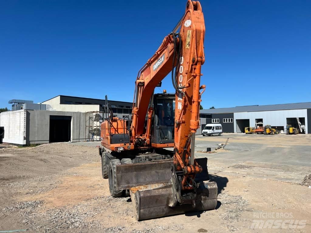 Doosan DX 140 W  휠 굴삭기