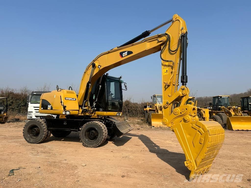 CAT M 320D  휠 굴삭기