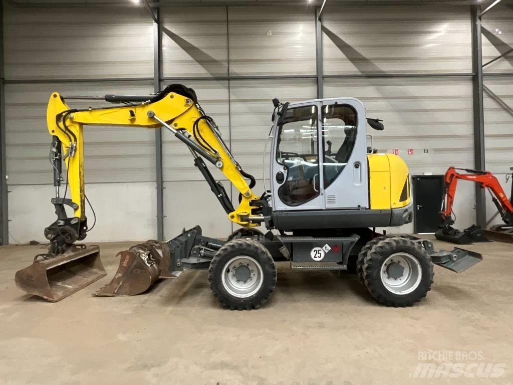 Neuson EW 100  휠 굴삭기