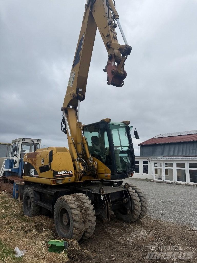 CAT M 313 C  휠 굴삭기