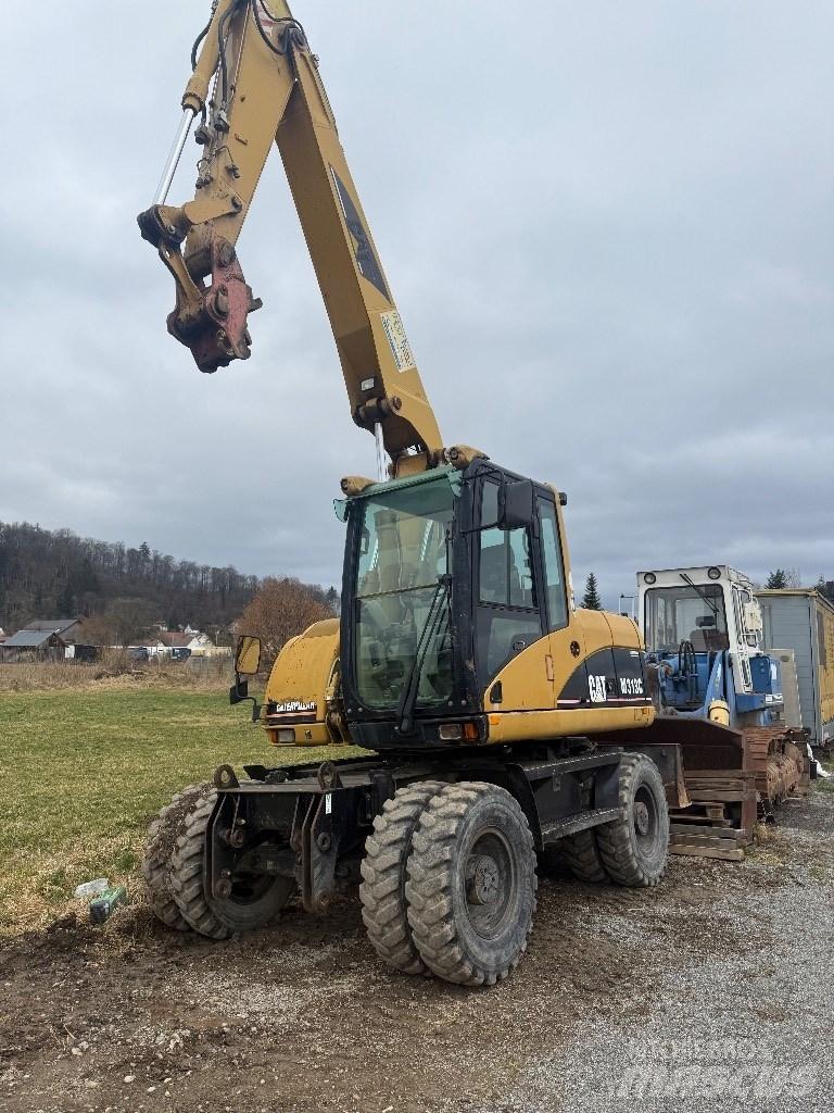 CAT M 313 C  휠 굴삭기