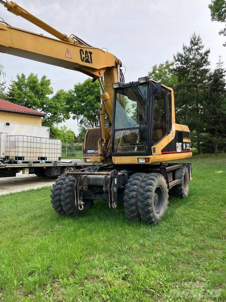 CAT M 312  휠 굴삭기