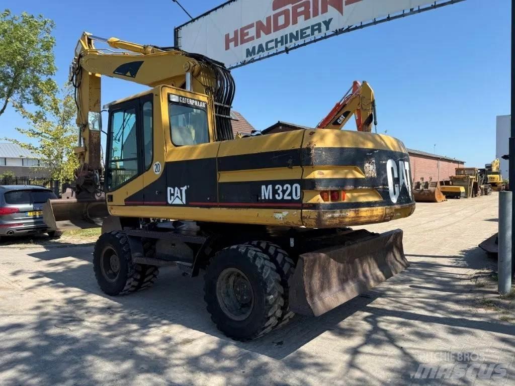 CAT M320 2001  휠 굴삭기