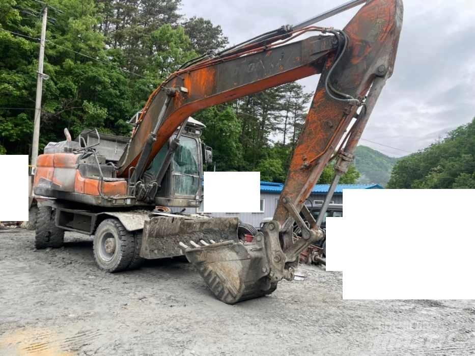 Doosan DX 210 W  휠 굴삭기