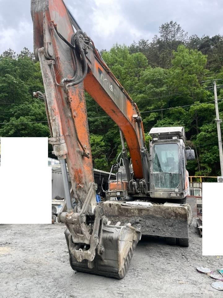 Doosan DX 210 W  휠 굴삭기