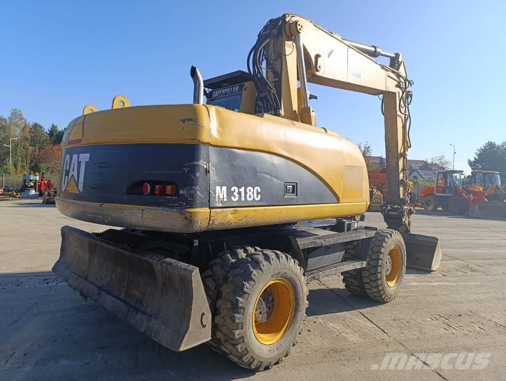 CAT M 318 C  휠 굴삭기