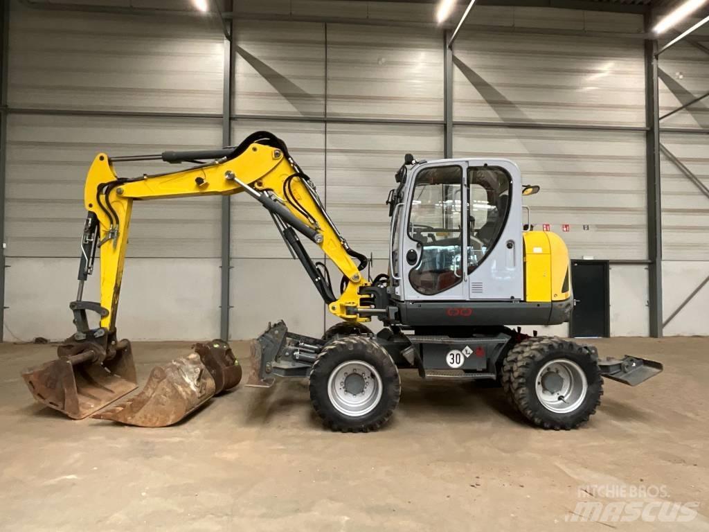 Neuson EW 100  휠 굴삭기