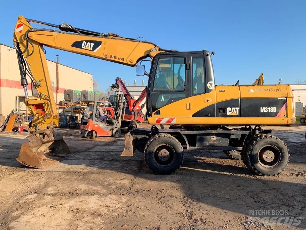 CAT M 318 D  휠 굴삭기