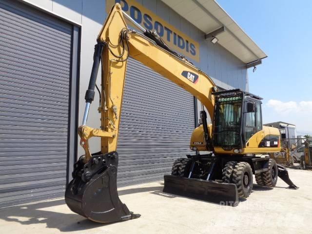 CAT M 318 D  휠 굴삭기