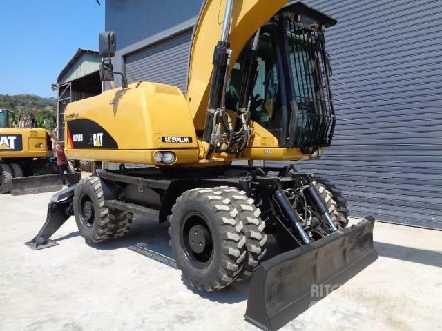 CAT M 318 D  휠 굴삭기