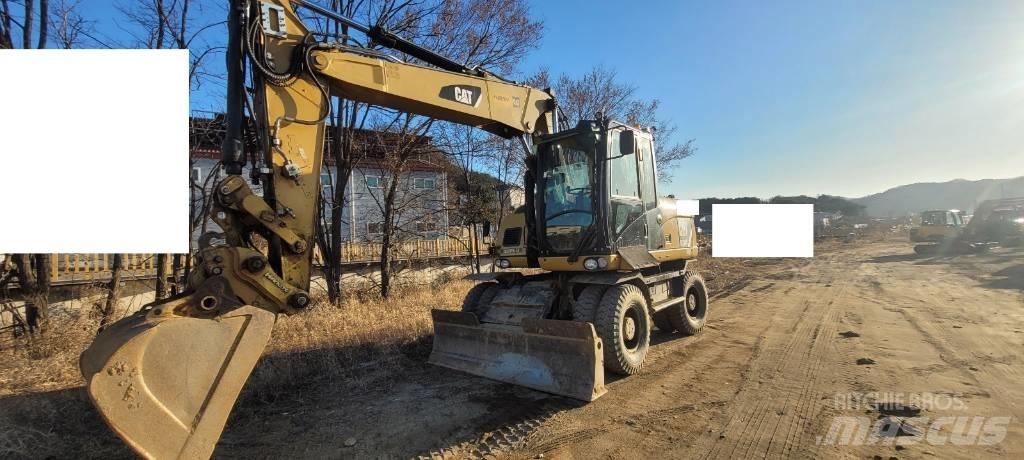 CAT M 313 D  휠 굴삭기