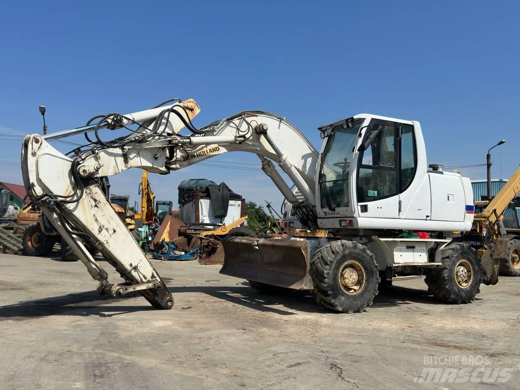 New Holland MH Plus  휠 굴삭기