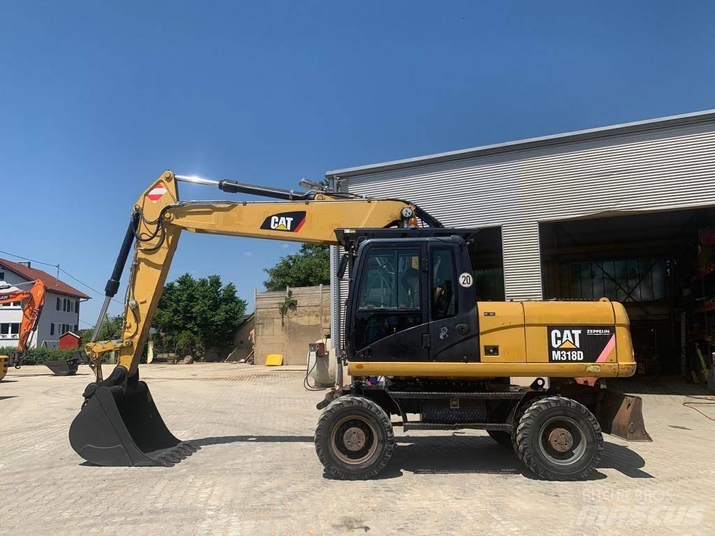 CAT M 318 D  휠 굴삭기