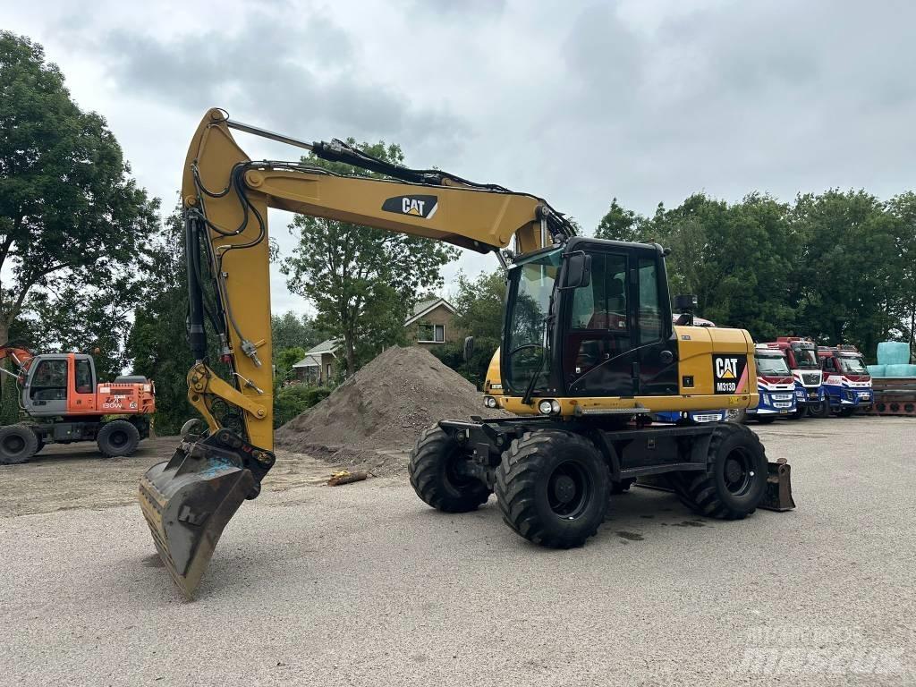CAT M 313 D  휠 굴삭기