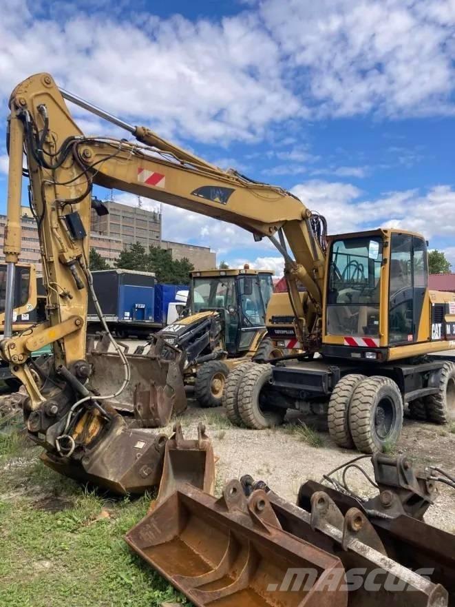 CAT M 312  휠 굴삭기