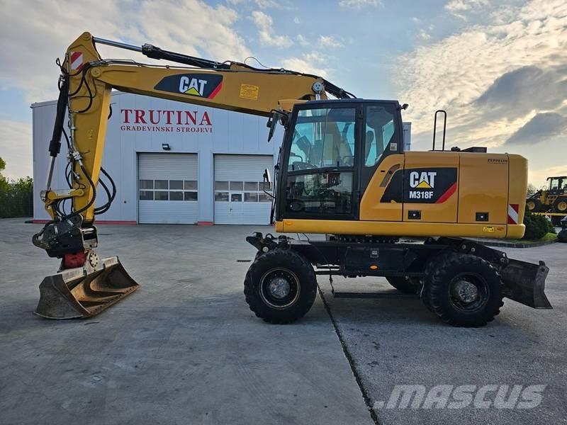 CAT M 318 F  휠 굴삭기