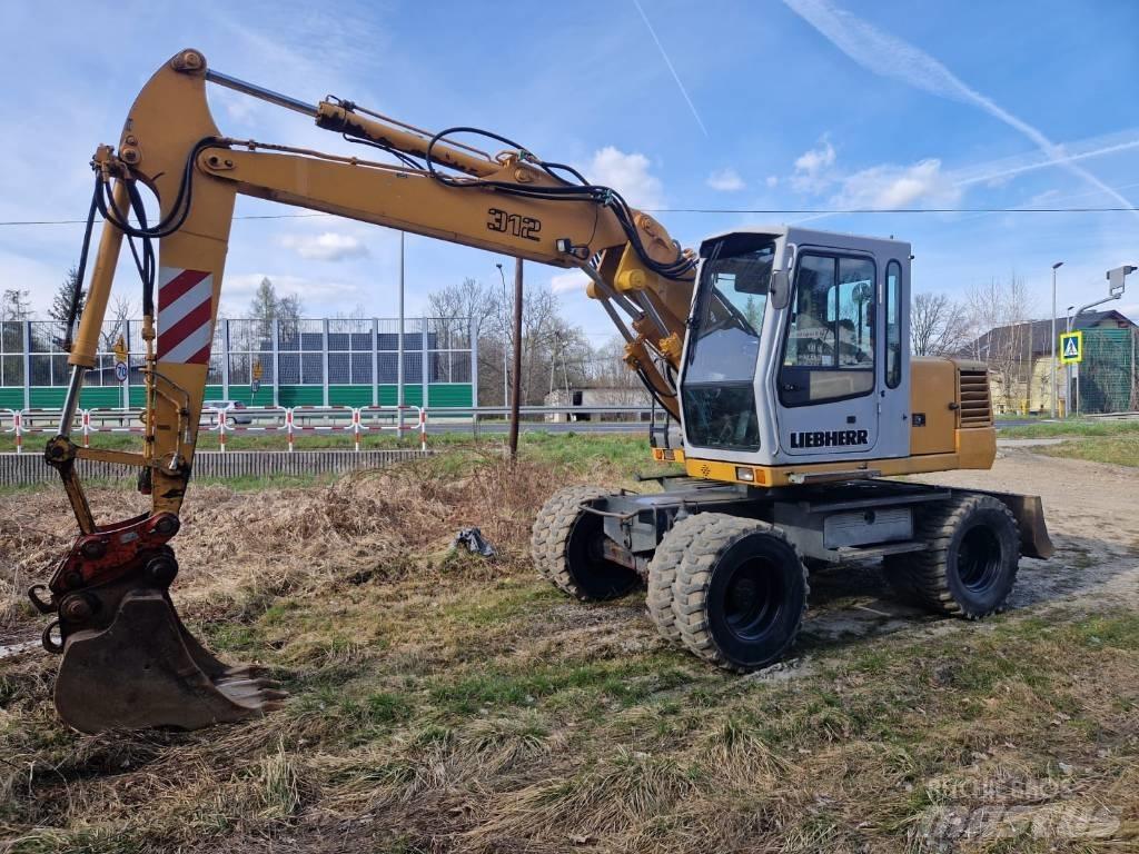 Liebherr 312 A  휠 굴삭기