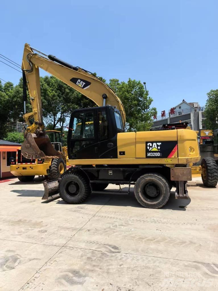 CAT M 320  휠 굴삭기