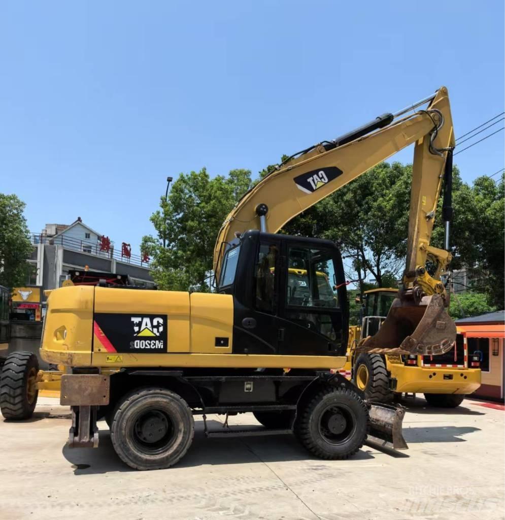 CAT M 320  휠 굴삭기