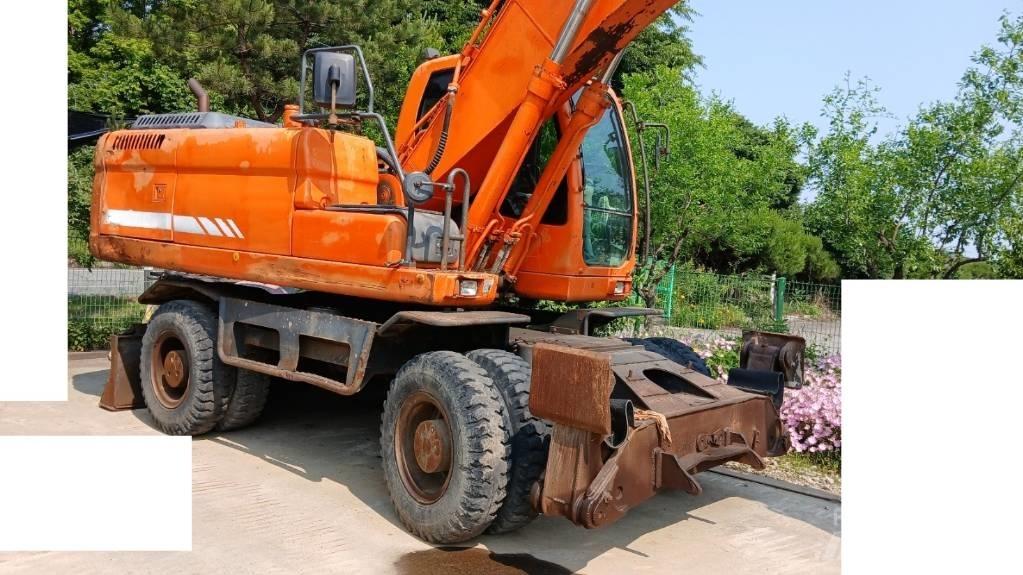 Doosan DX 210 W  휠 굴삭기