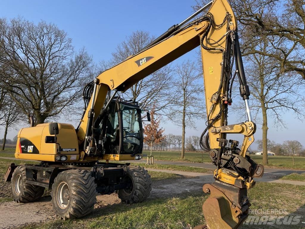 CAT M 313 D  휠 굴삭기