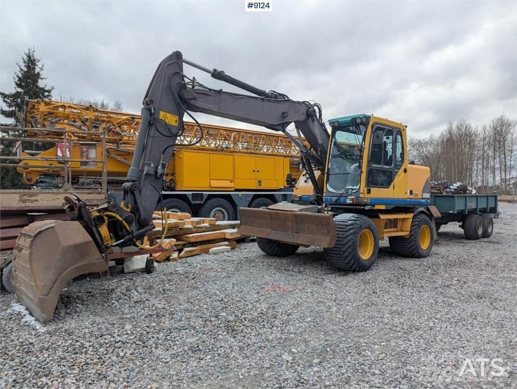Volvo EW140B  휠 굴삭기