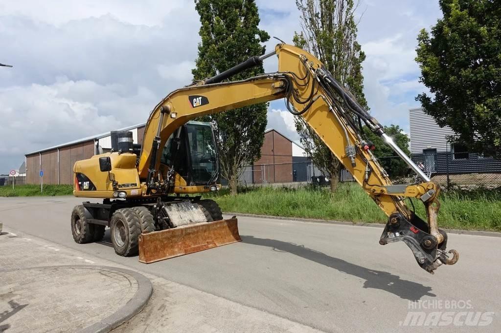 CAT M313 D  휠 굴삭기
