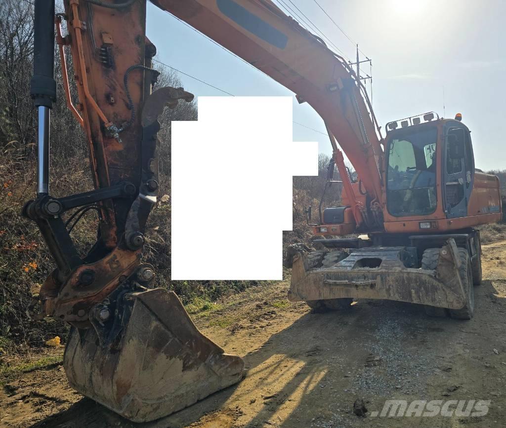 Doosan DX 210 W  휠 굴삭기