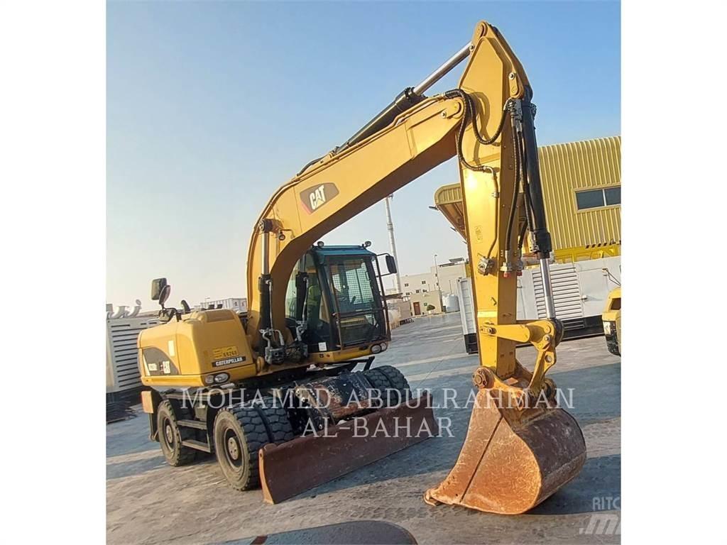 CAT M320D2  휠 굴삭기