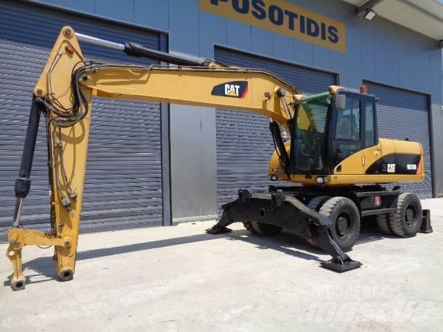CAT M 318 D  휠 굴삭기