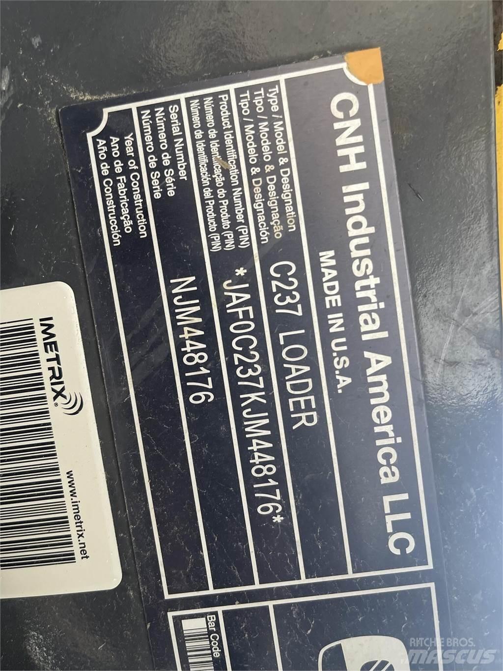 New Holland C237  스키드로더