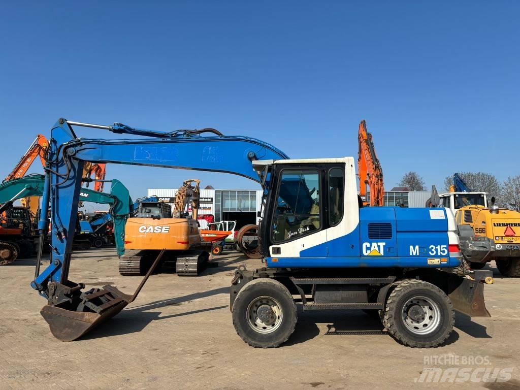 CAT M 315  휠 굴삭기