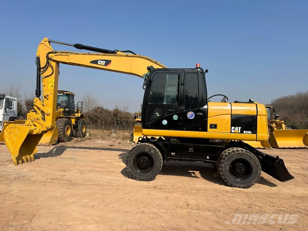 CAT M 320D  휠 굴삭기