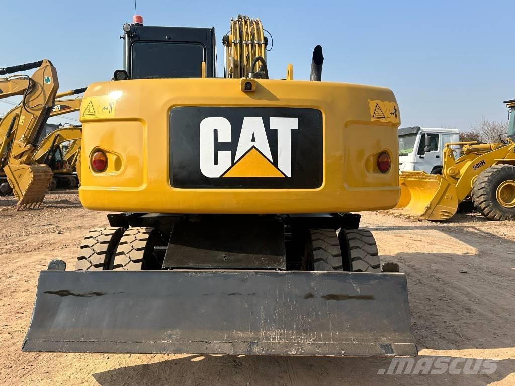 CAT M 320D  휠 굴삭기