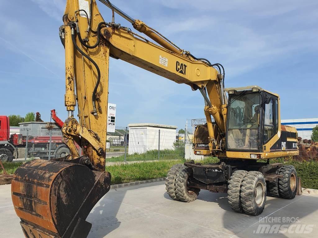 CAT M 318  휠 굴삭기