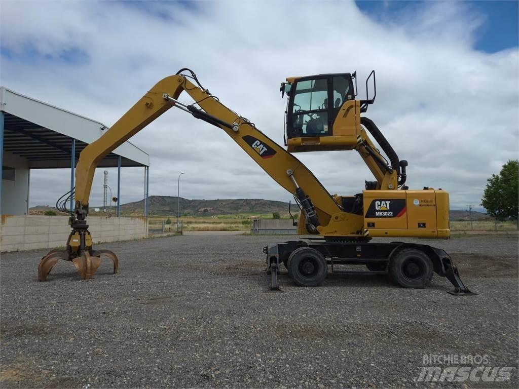 CAT MH3022  휠 굴삭기
