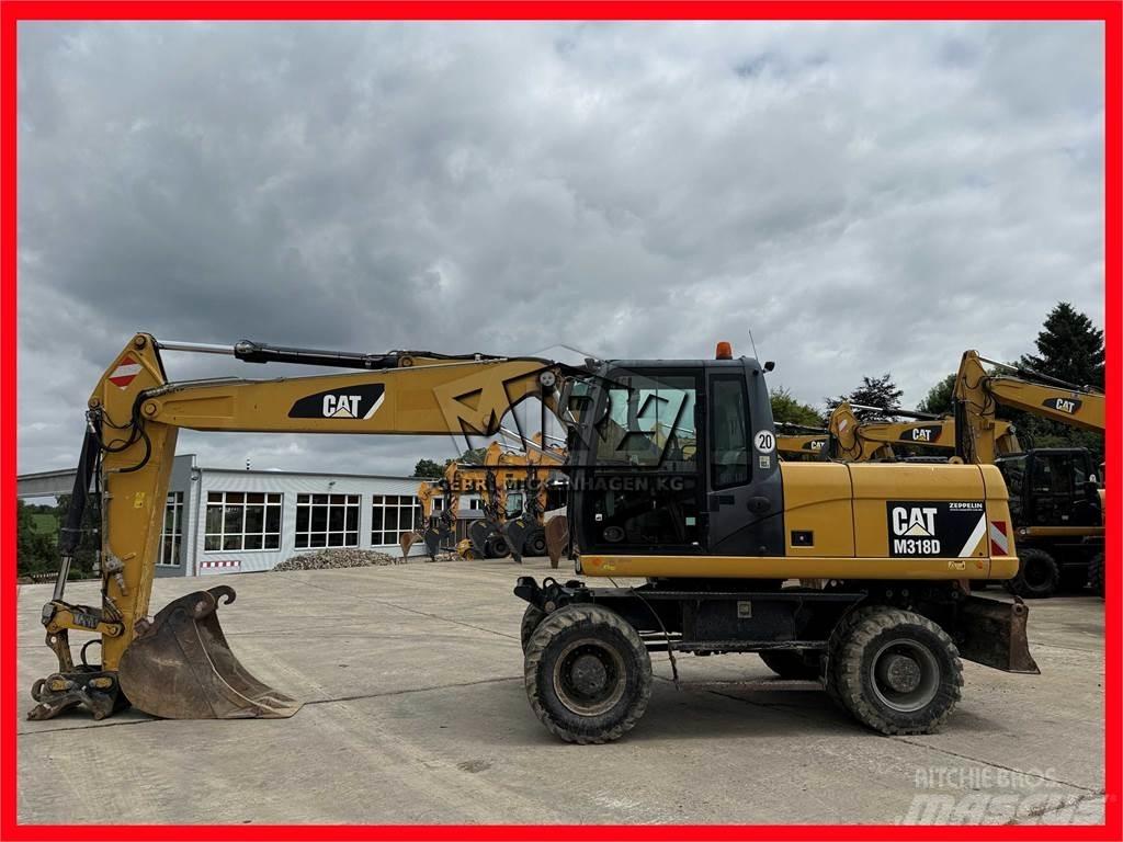 CAT M 318 D  휠 굴삭기