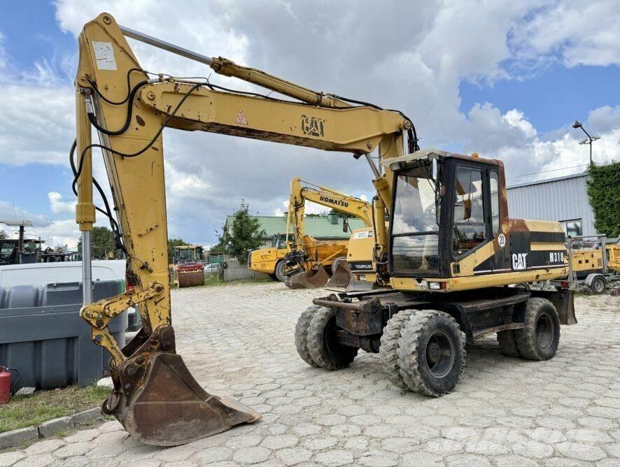 CAT M318  휠 굴삭기